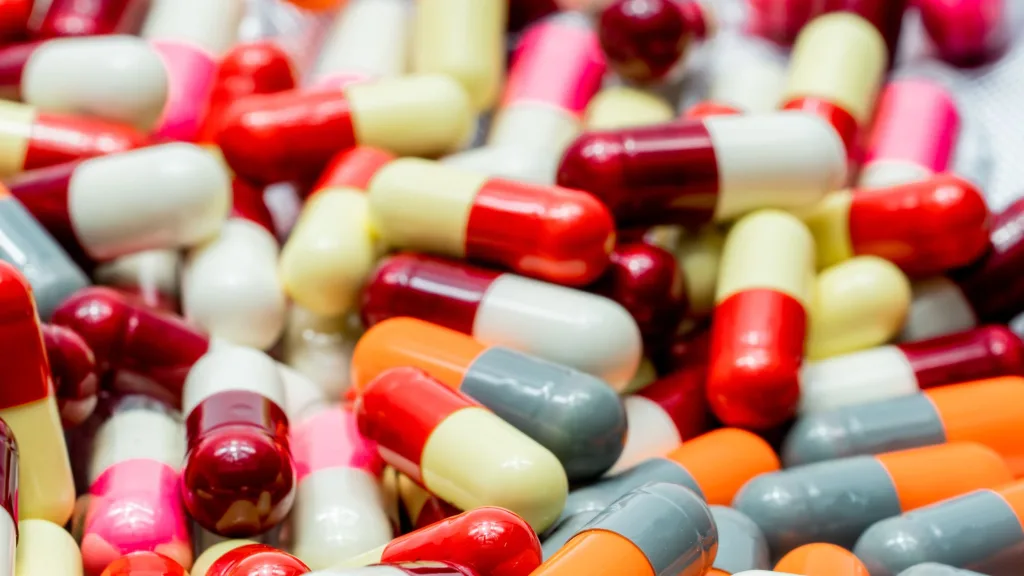 A close-up shot of multicolored bulk capsules.