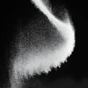 White powder cascading against a black background.