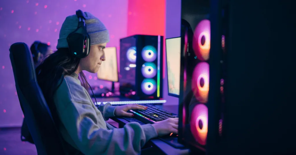 An esports athlete focusing intently on a computer game.