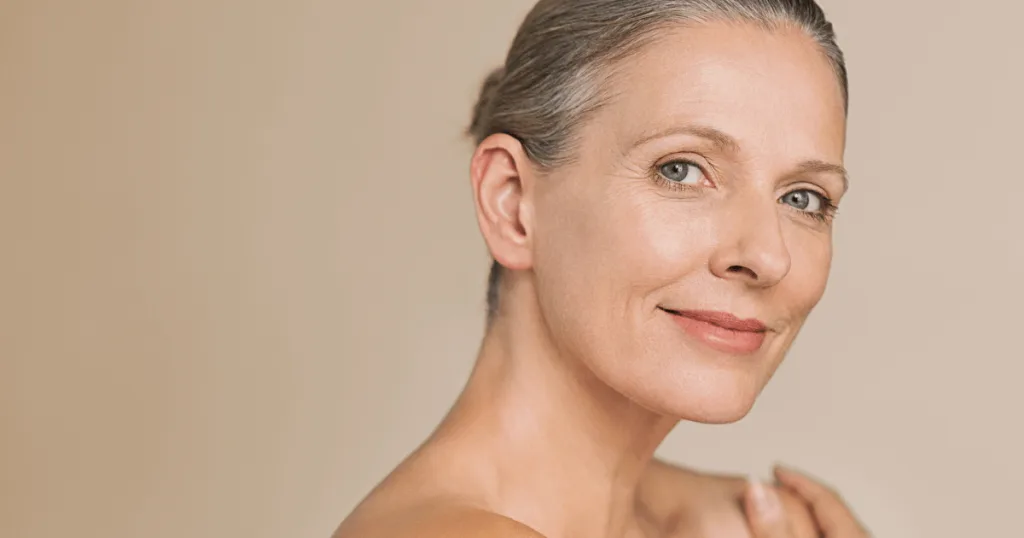 An older woman with clear, glowing skin.