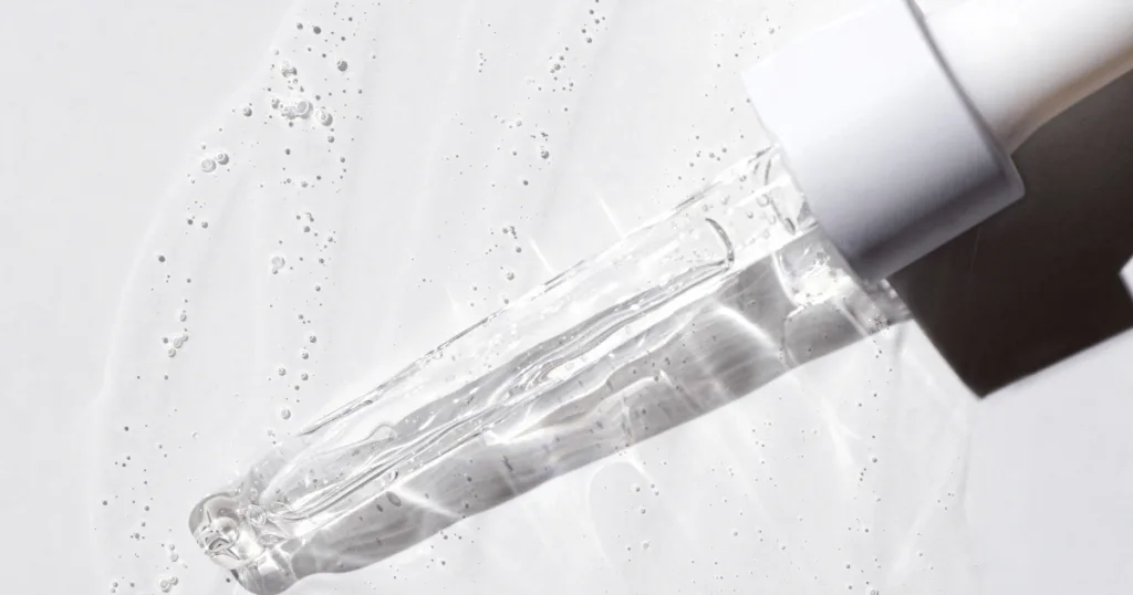 A dropper containing glycerin against a white background.